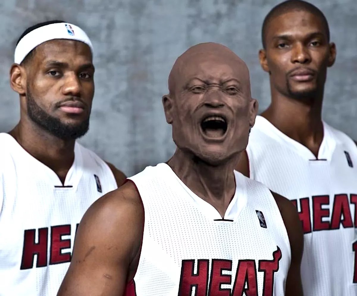 photo of the Miami Heat "Big Three" of LeBron James, Dwyane Wade, and Chris Bosh, with Wade's head subbed out for the screaming head of his statue outside the Kaseya Center