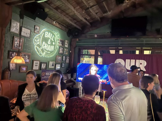 People watching MSNBC during election watch party at Ball & Chain.