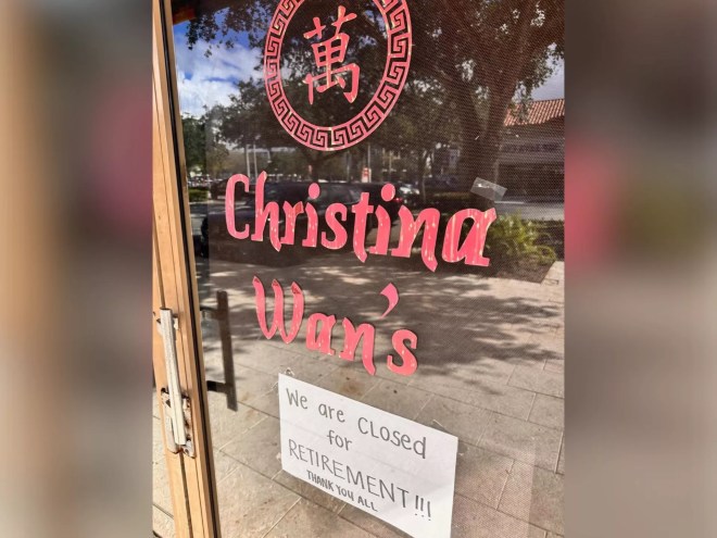 a sign on a glass door