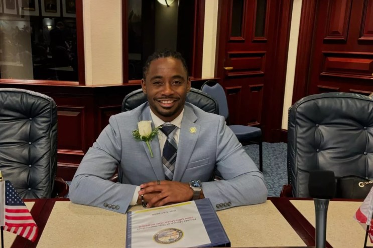 Rep. Daryl Campbell smiles in his seat inside the Florida House of Representatives