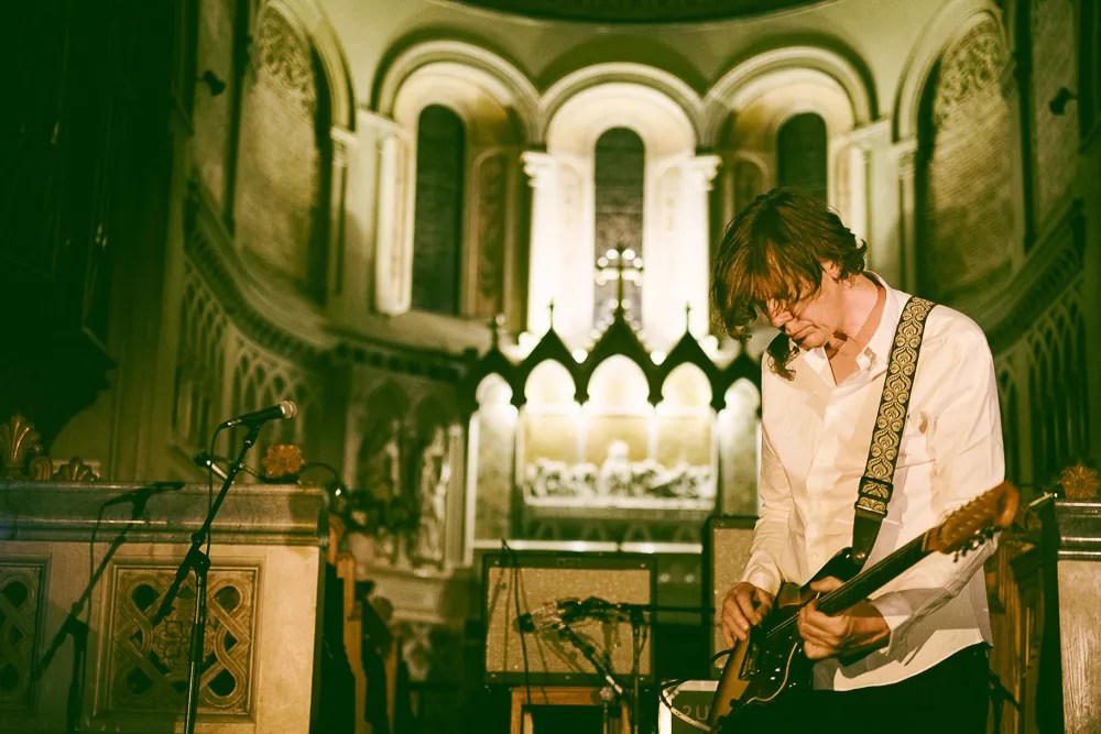 Thurston Moore performing on stage