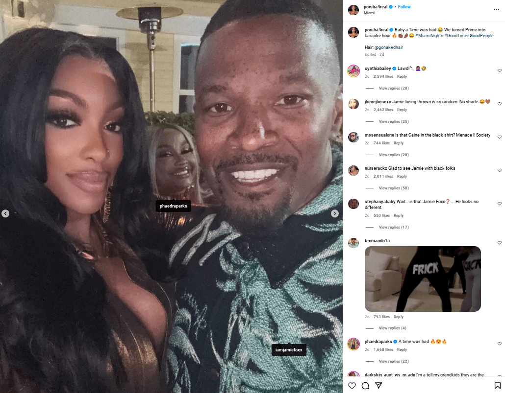 Porsha Williams poses for a selfie with Jamie Foxx, who wears a tropical print shirt, while Phaedra Parks smiles in the background at Miami’s Prime 112.