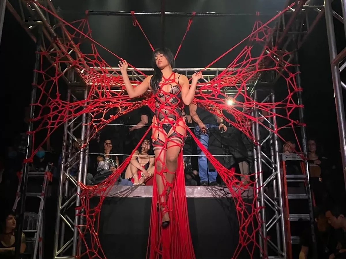 Marie Sauvage tied up during a Shibari performance