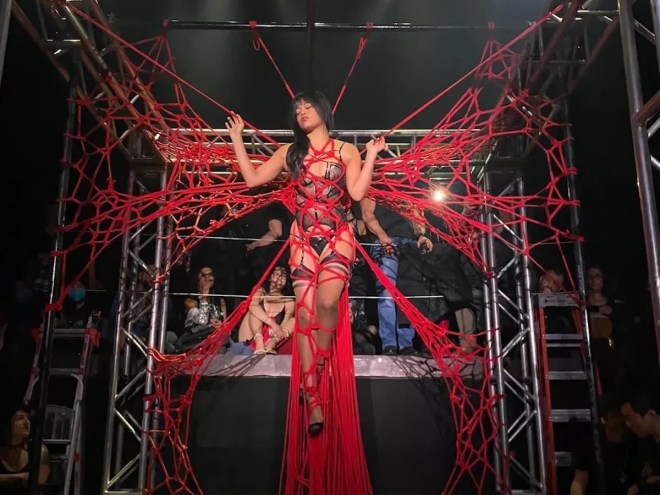 Marie Sauvage tied up during a Shibari performance