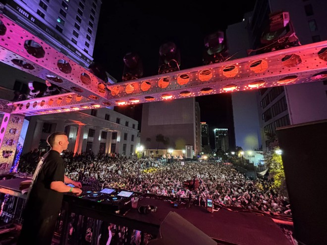 Michael Bibi performing outdoors in downtown Miami