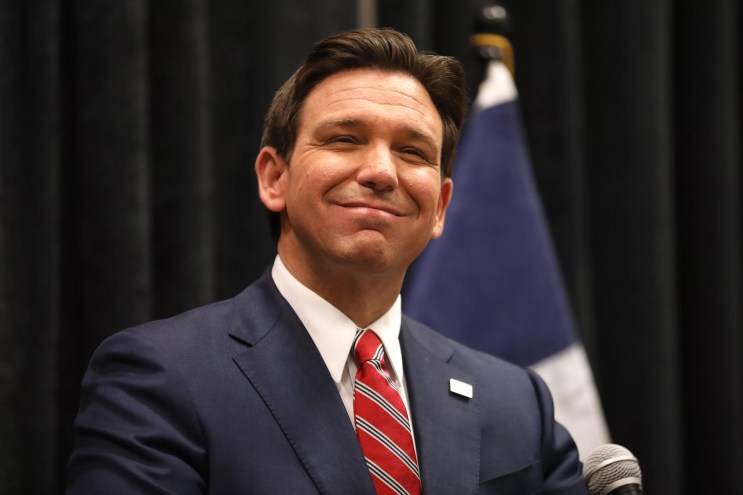 Ron DeSantis making a close-mouthed smile