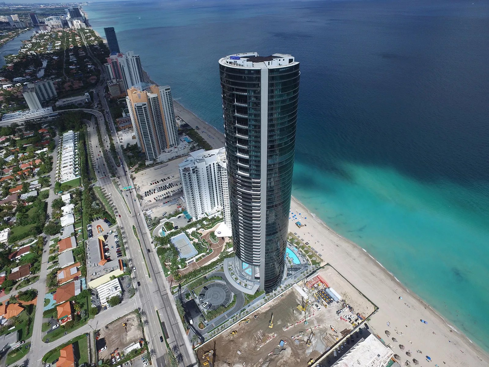 An aerial view of the Porsche Design Tower in Sunny Isles Beach, overlooking the Atlantic Ocean