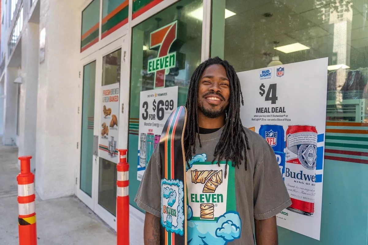 Blue the Great standing in front of a 7-Eleven