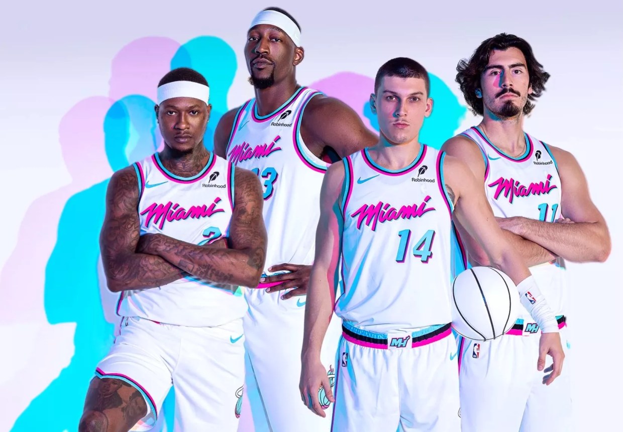 Terry Rozier, Bam Adebayo, Tyler Herro, and Jaime Jaquez Jr. model the Heat's rebooted white <i>Miami Vice</i>-inspired uniforms.