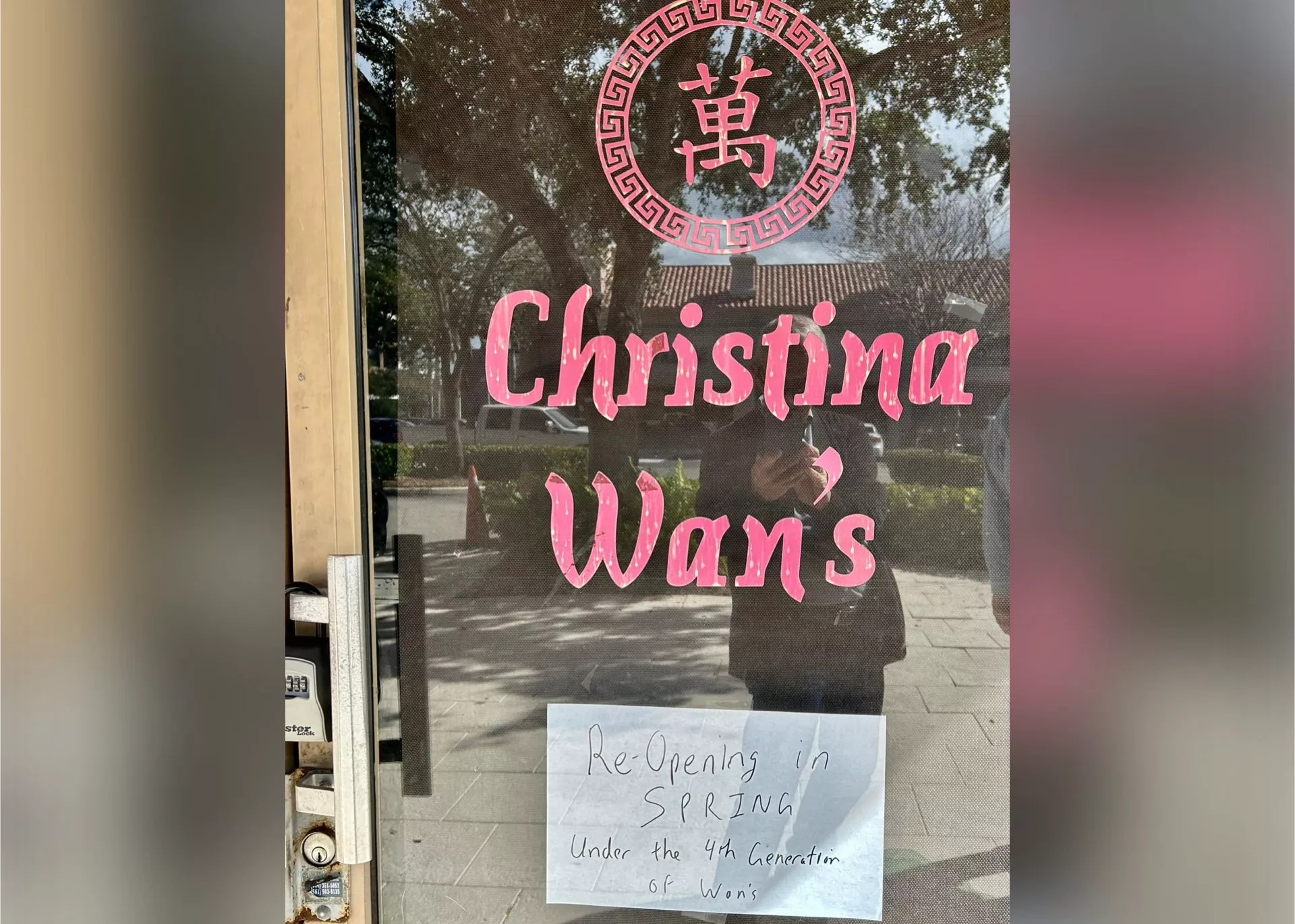 a glass door with red letters