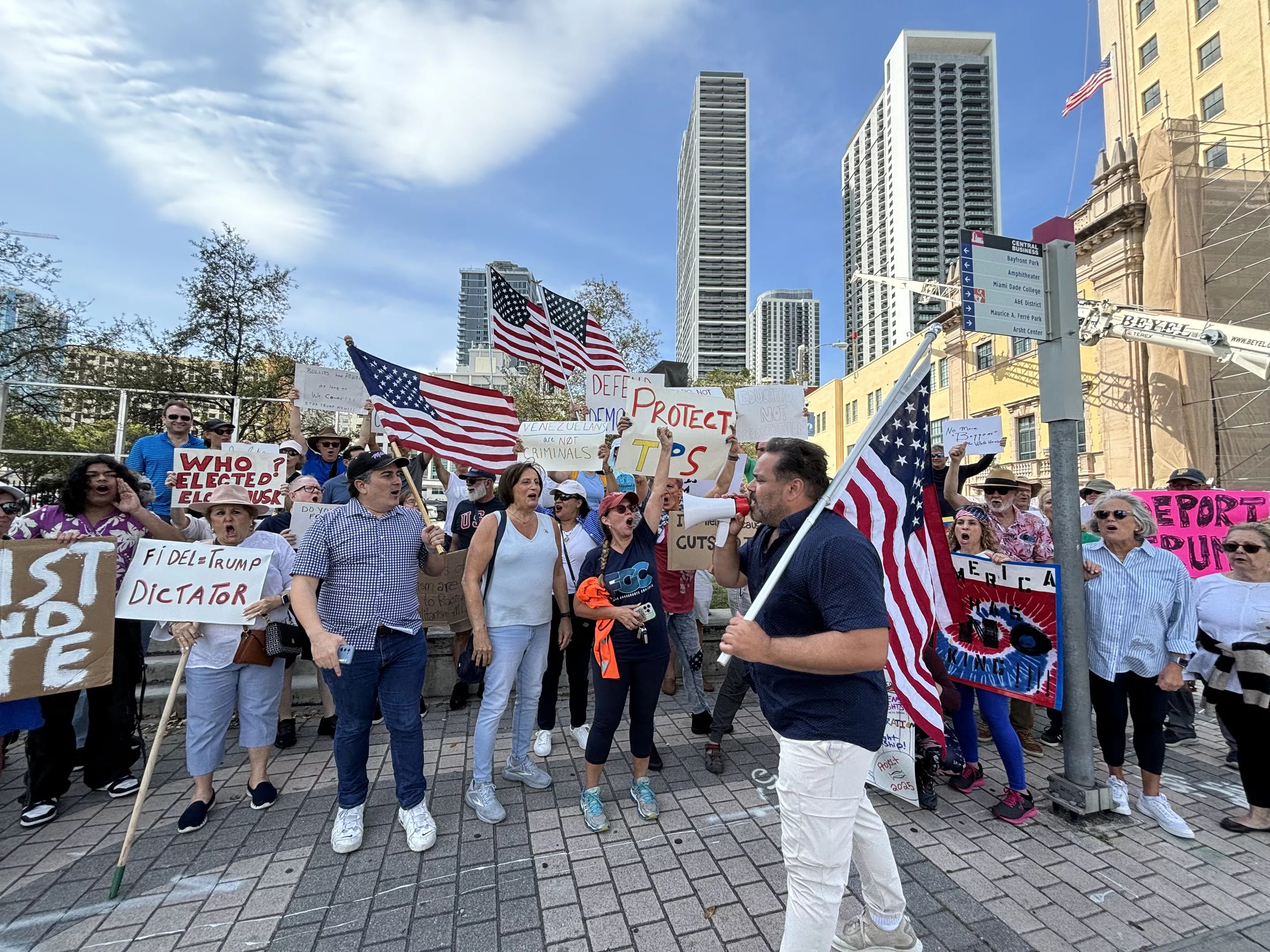 Protesters gathered on the street corner chanting in downtown Miami
