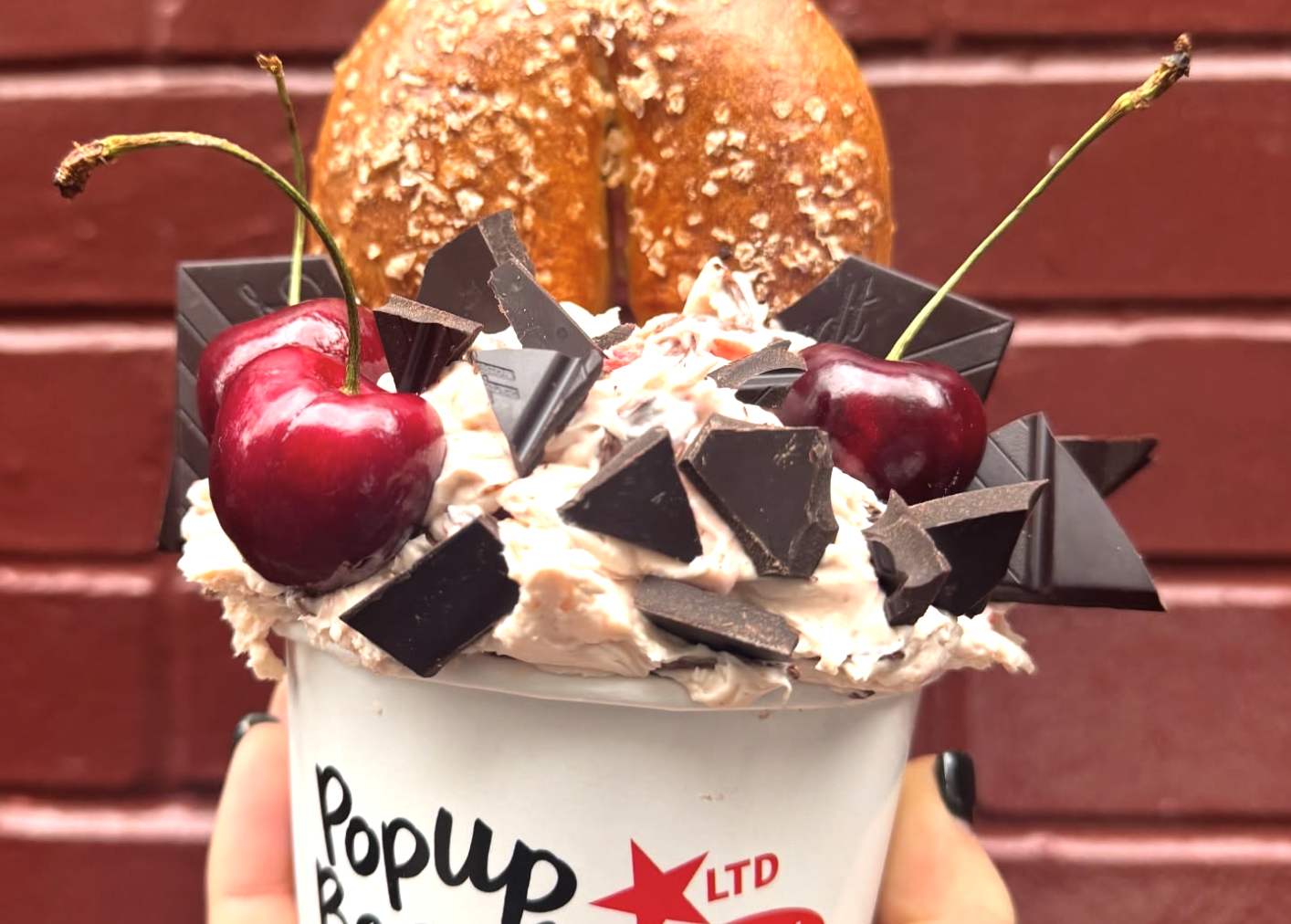 bagel and cream cheese in cup