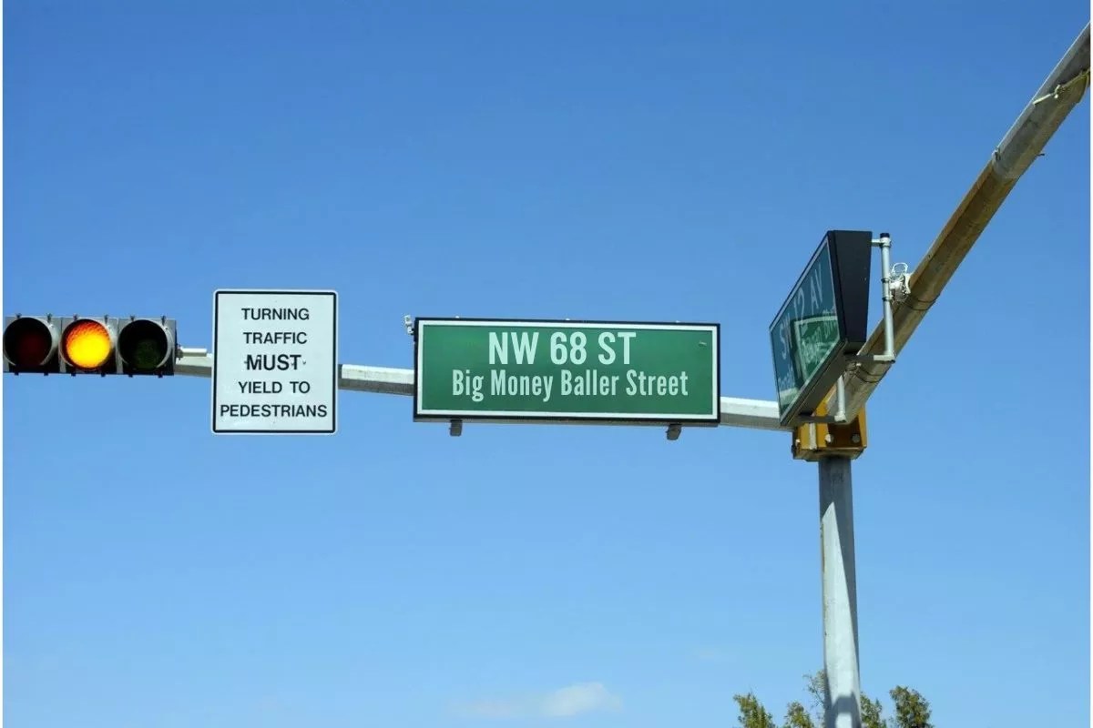 A photoshopped image of a street sign that reads "NW 68 ST. Big Money Baller Street."