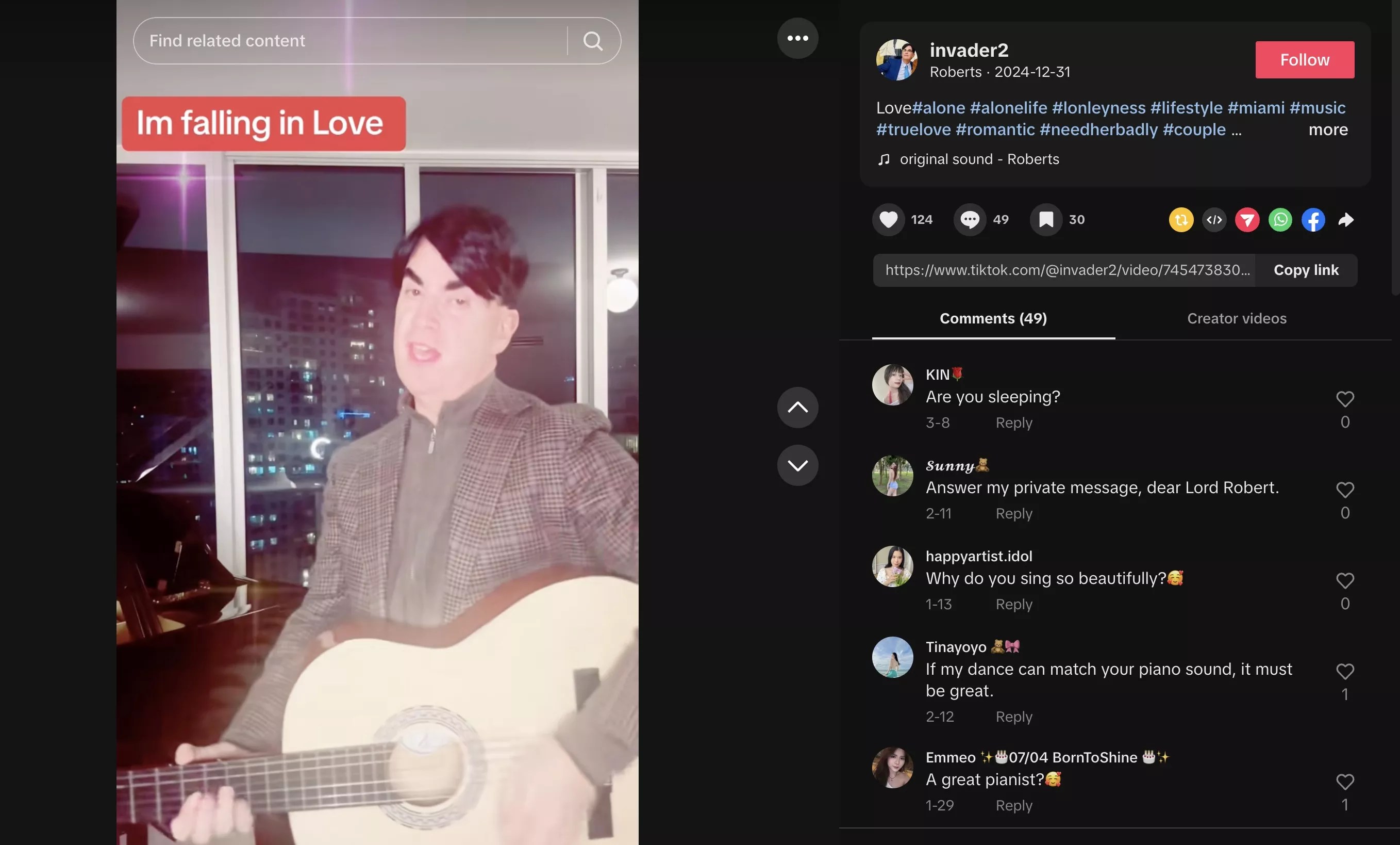 Screenshot of a man with dark eyebrows and a dark toupee singing and holding the acoustic guitar