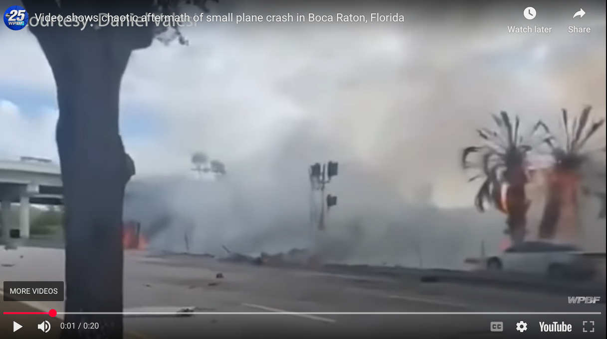 A plane crash causes debris to smoke and scatter across a roadway