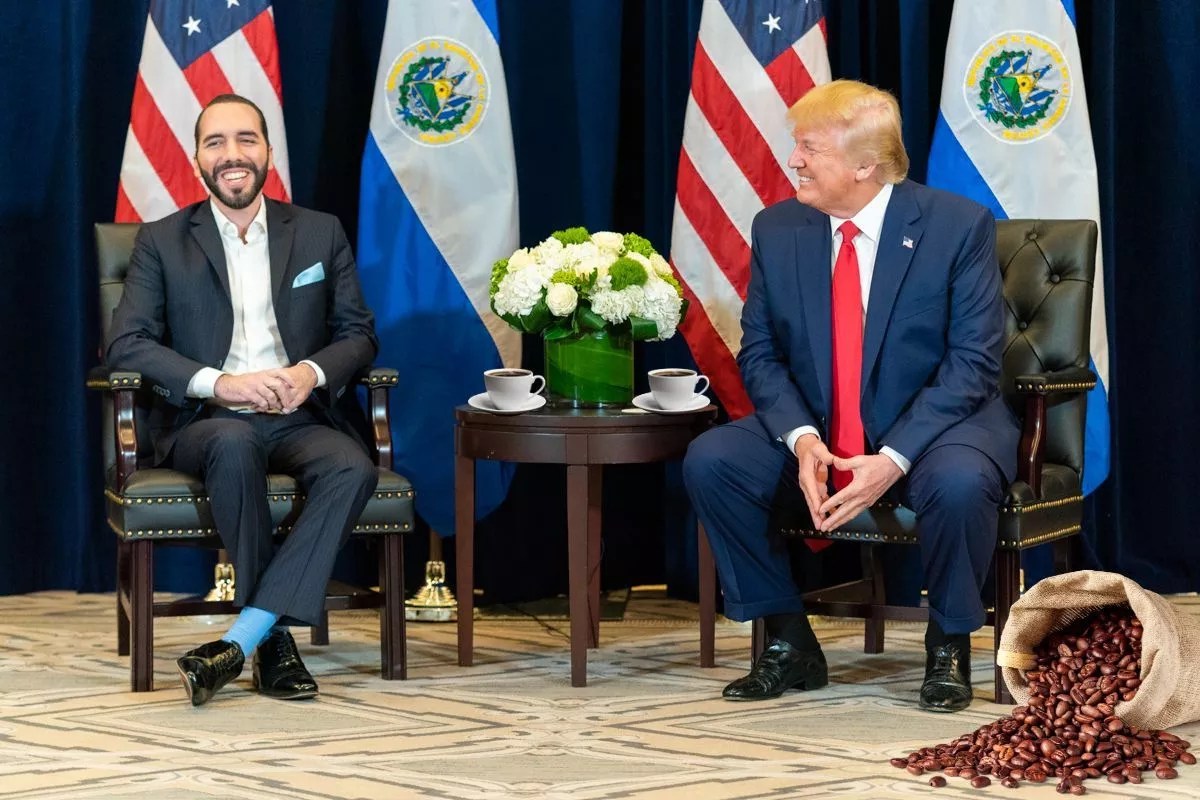 The president of El Salvador, Nayib Bukele, and Donald Trump have a chat while an artist conception of a bag of coffee beans rests in the corner
