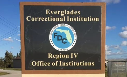 A sign reads: Everglades Correctional Institution Region IV Office of Institutions