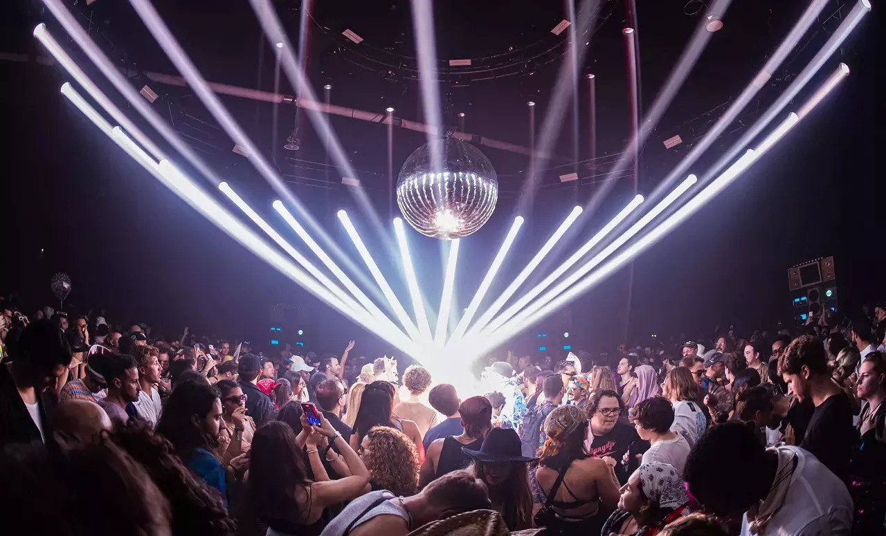 laser lights, a disco ball, and a crowd