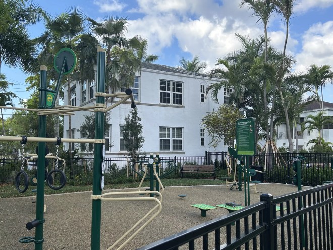 East Shenandoah Park and an outdoor gym that sits behind a white residential building.
