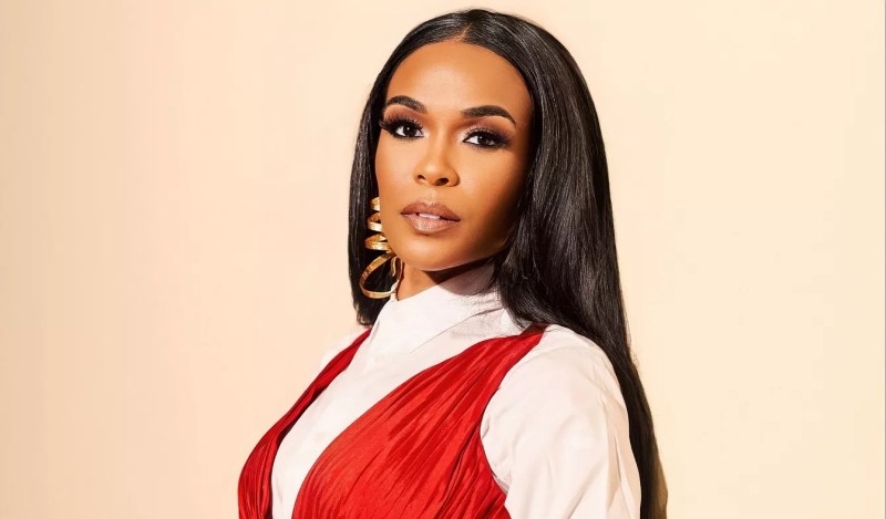 headshot of singer Michelle Williams in a red and white outfit
