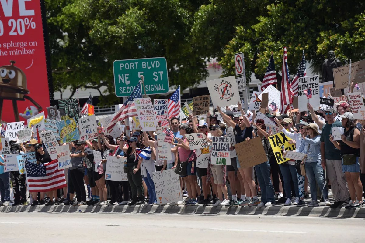 Protesters demonstrate against President Donald Trump's policies in Miami.