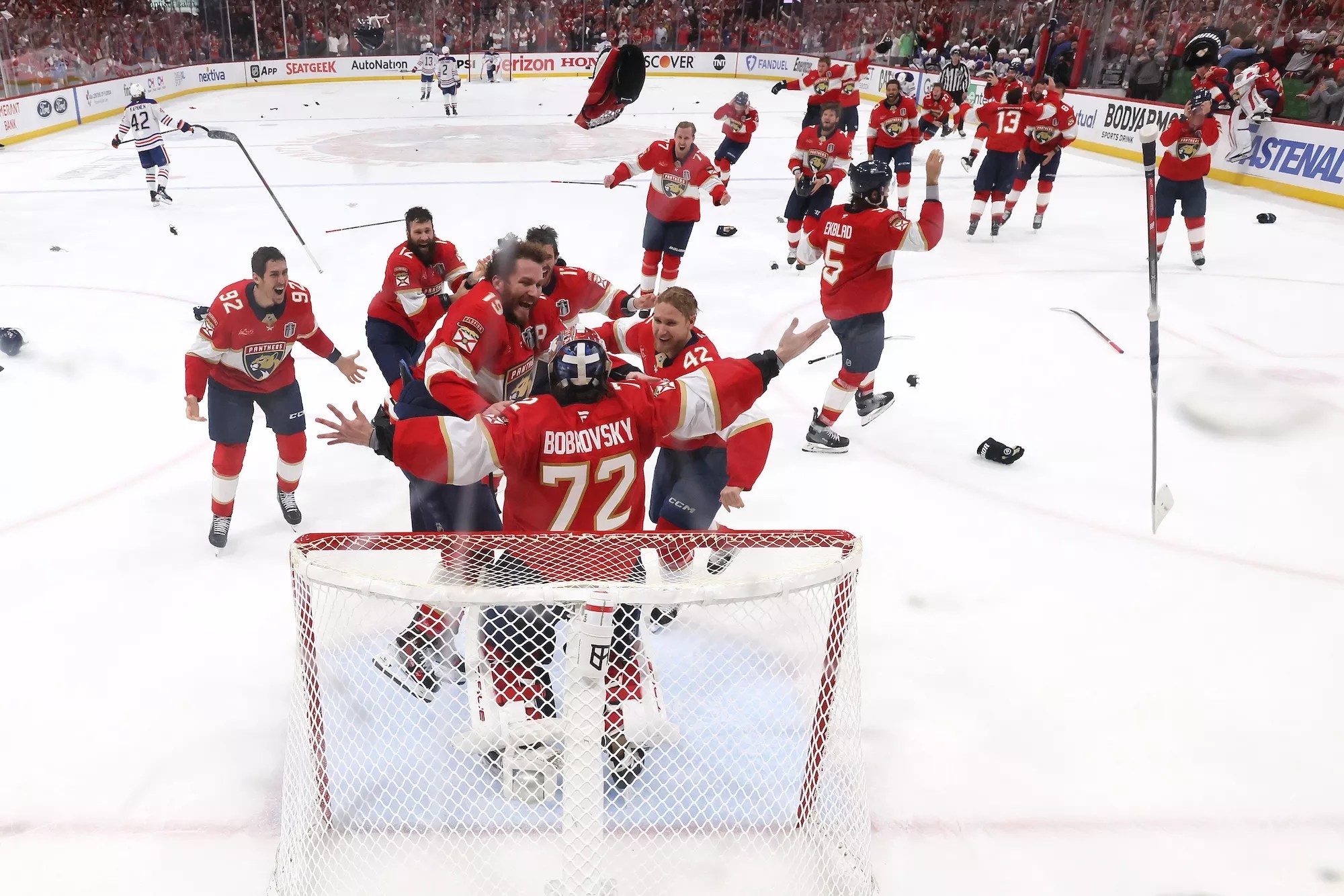 Florida Panthers players swarm around goalie Sergei Bobrovsky (no. 72) following the team's Game 6 Stanley Cup clinching win over the Edmonton Oilers at Amerant Bank Arena in Sunrise, Florida, on June 17, 2025