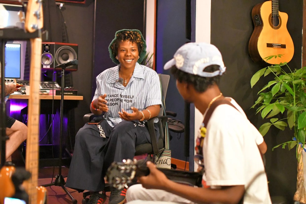 two musicians working in a music studio