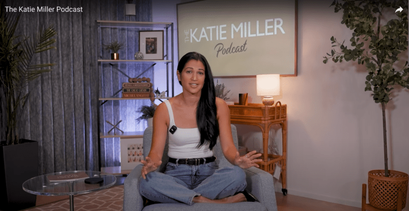 A photo of Katie Miller hosting her new podcast.