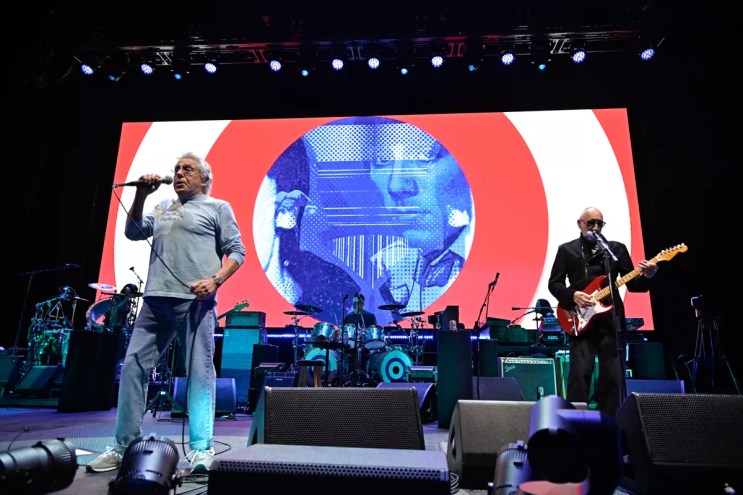 The Who band playing on stage.