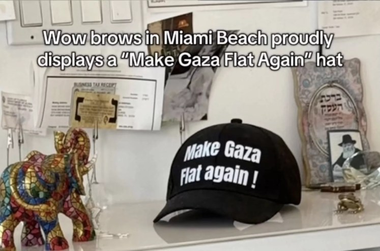 A black hat with the text "Make Gaza flat Again!" sits on a counter inside a salon